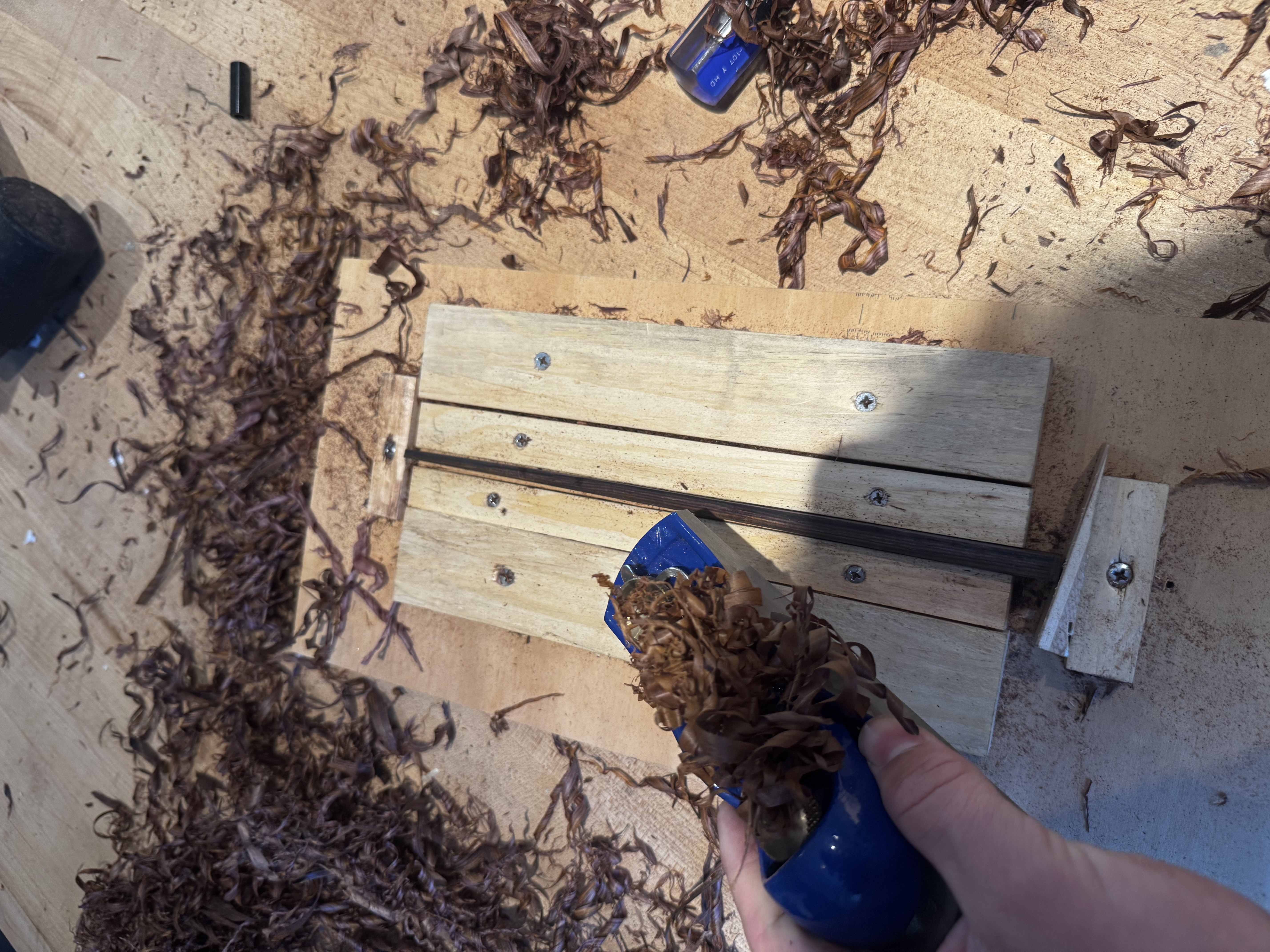 Planing a chopstick blank in a custom wooden jig