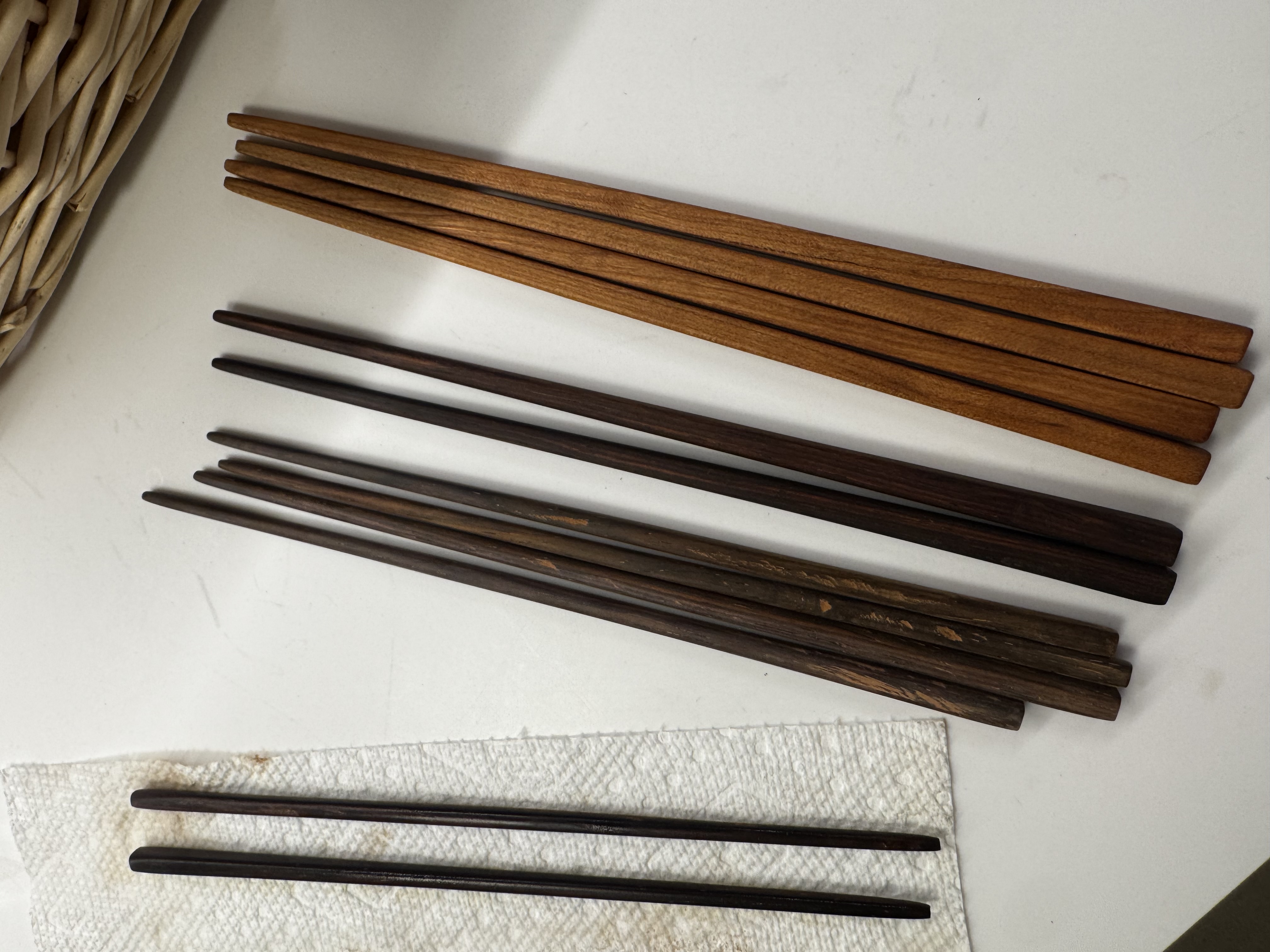 Chopstick sets in lignum vitae, walnut, and lighter woods
